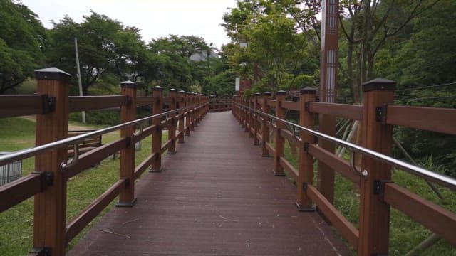 Peaceful Wooden Bridge in a Lush Park