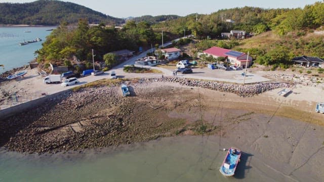 Coastal village with boats and greenery