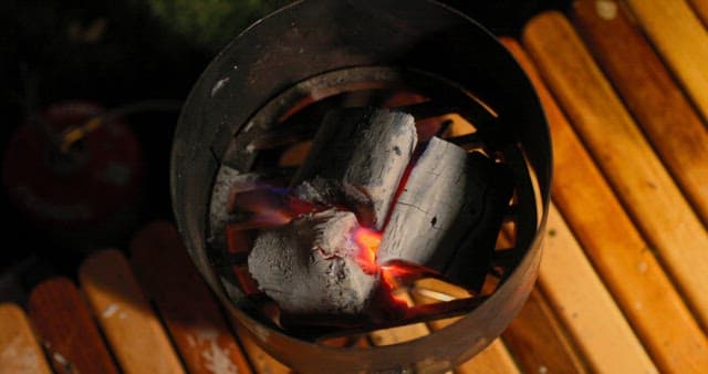 Burning Charcoal in a Grill at Night