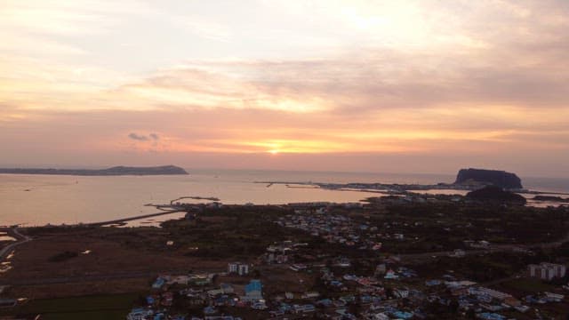 Sunset over a coastal town and sea