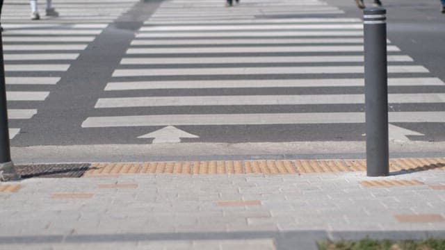 Pedestrians at Crosswalk on Sunny Day