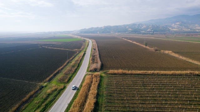 Car on Countryside Roads between Farmlands