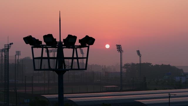 Silhouette of an Unlit Lighting Fixture in the Evening