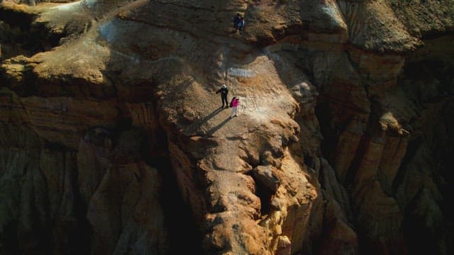 Hikers Exploring a Rugged Desert Landscape