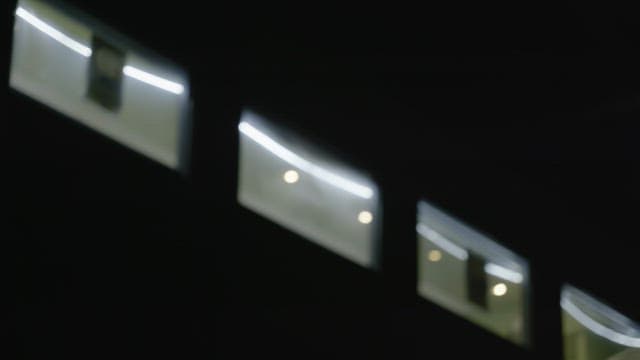Window of a building with a view of the interior lit up at night