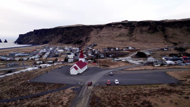Coastal village with a red-roofed church