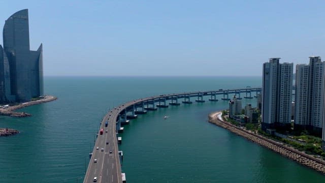 Busan cityscape with modern high-rise buildings, Gwangan Bridge, and the ocean