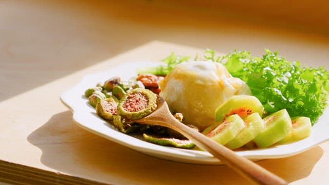 Fresh Salad with Figs on Sunny Table