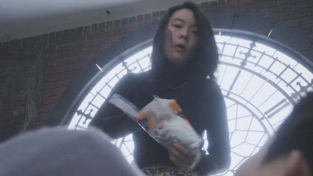 Woman trying to exorcise a person by sprinkling salt on him