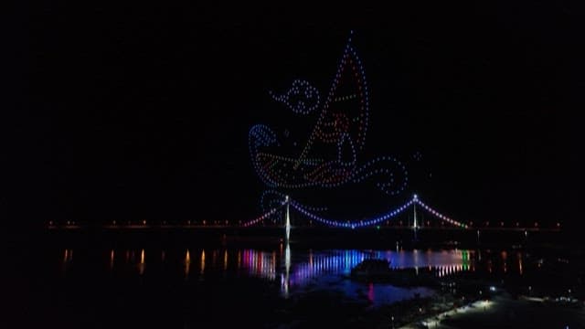 Night View of a Bridge with Festive Lights