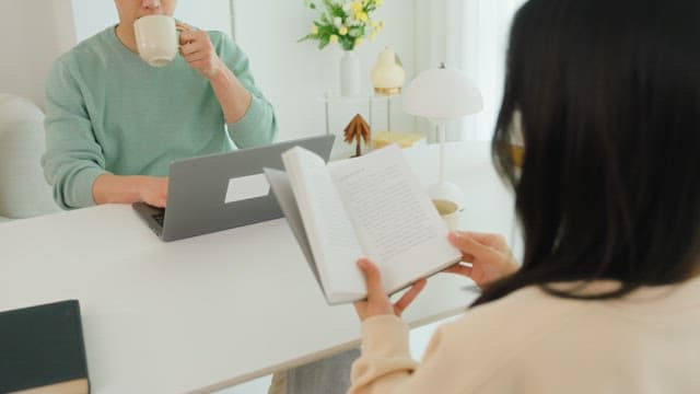 Couple sitting and relaxing in a bright living room