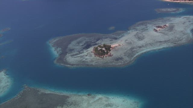 Tropical island surrounded by the sea