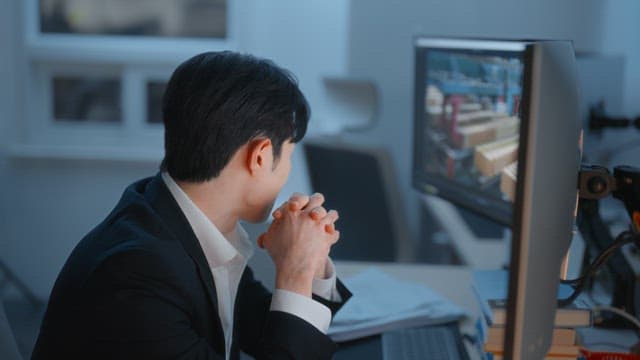 Man in an office reviewing documents