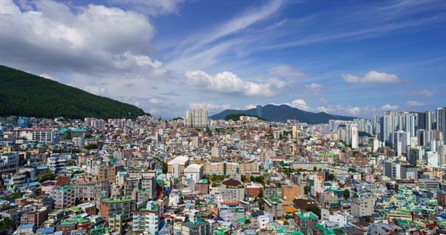 Urban view with densely packed buildings under a cloudy sky