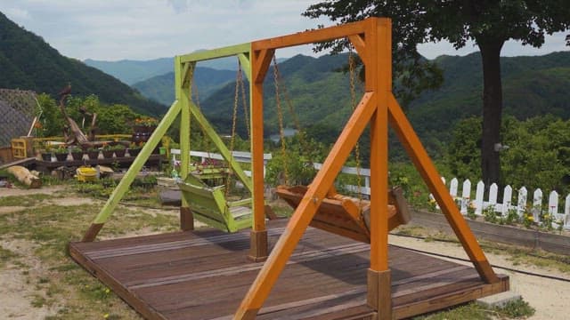 Swing in the Garden Overlooking the Green Mountains