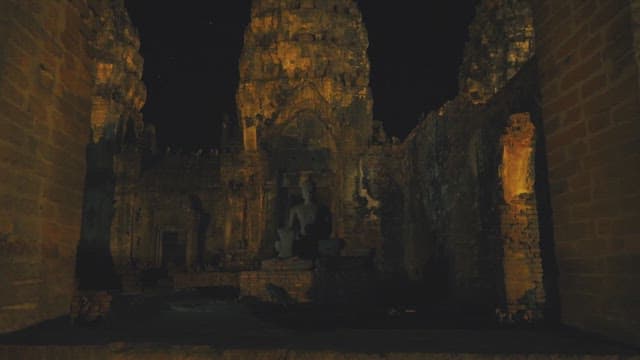 Night of Buddha Statue in Ancient Majestic Stone Temple