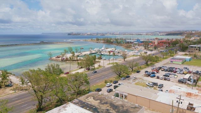 Scenic view of marina and clear sea