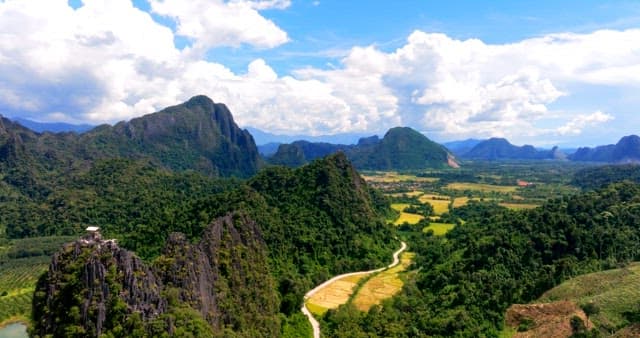 Serene Landscape with Mountains and Fields