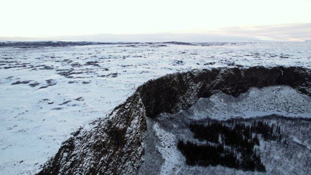 Snow-covered cliffs and vast landscape