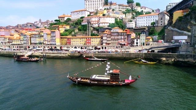 Boats and colorful houses along the Douro riverside