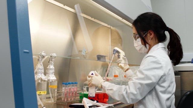 Scientist conducting a biotechnology experiment in a laboratory