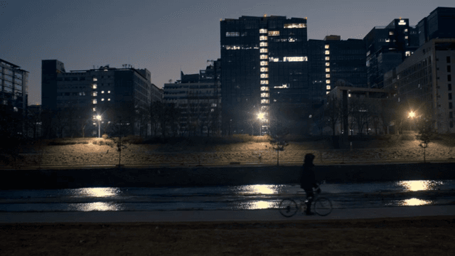 Night view of a city with buildings and river
