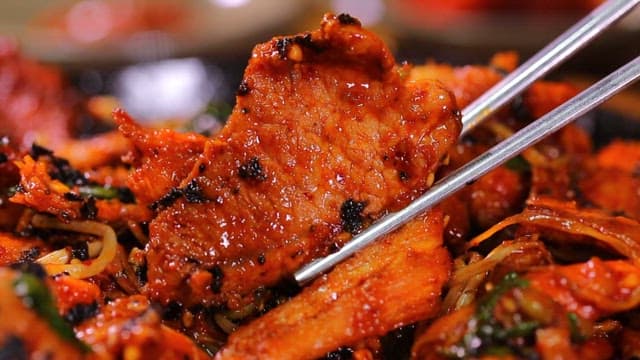 Appetizing and spicy grilled pork with seasoned deodeok