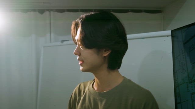 Young man giving a presentation indoors