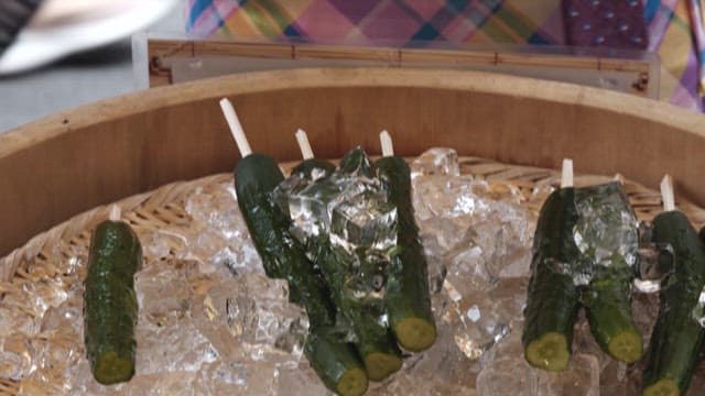 Cucumber Skewers on a Market Stall Filled with Ice