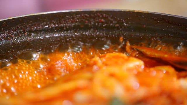 Spicy braised half-dried pollack simmering in a pot