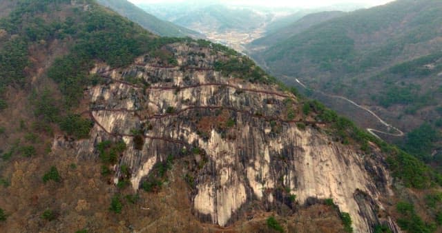 Winding Walking Path Surrounded by Steep Cliffs