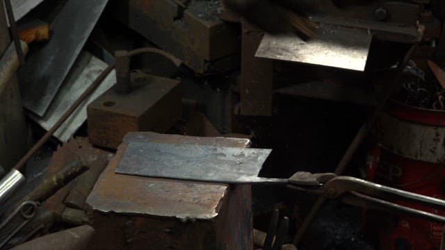 Metal being forged in a factory