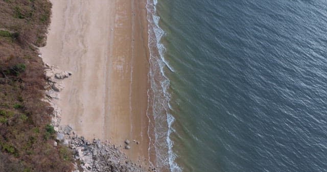 Waves Crashing on Sandy Shore