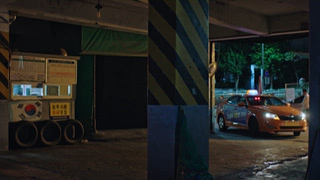 Taxi Entering Taxi Garage at Night with Headlights On