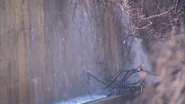 Water flowing down a concrete wall