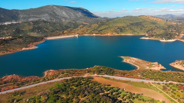 Zahara el gastor reservoir surrounded by green hills