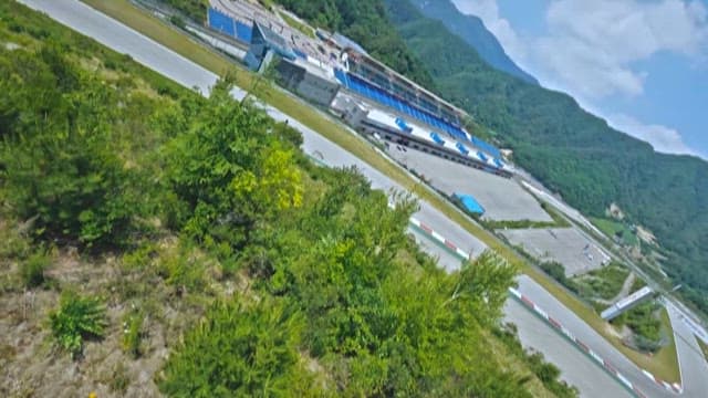 Aerial View of Race Car on a Circuit Track