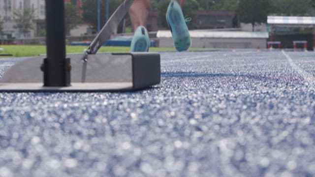 Athletes Training on a Track Field