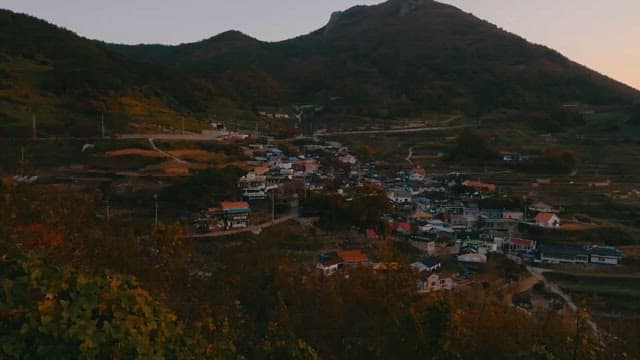 Seaside Village Nestled in Autumn Mountains