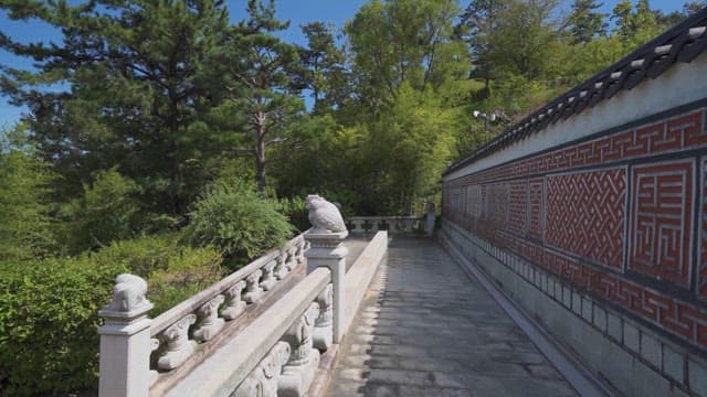 Traditional stone bridge in lush garden