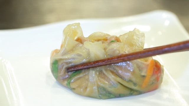 Chopstickful of warm Vietnamese spring rolls with shabu shabu