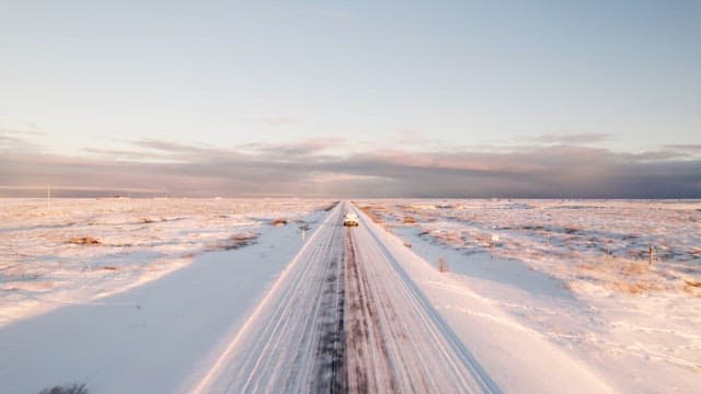 Car driving on a snowy road