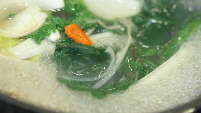 Vegetables boiling in a pot