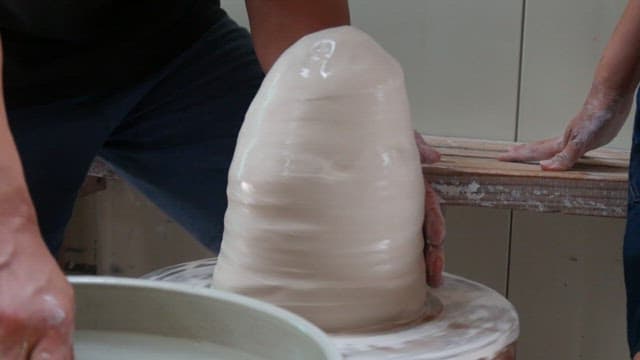 People making elaborate pottery