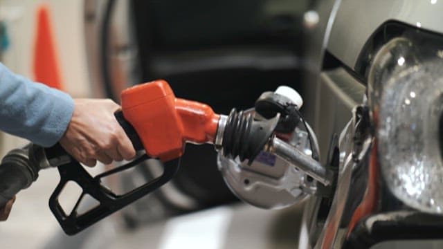 Refueling a car at a gas station