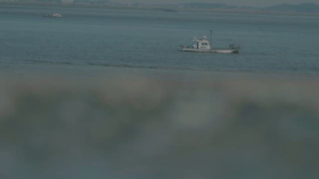 Wet Glasses on a Rock of Serene Seashore