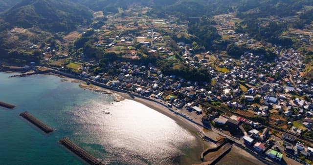 Coastal village with surrounding hills