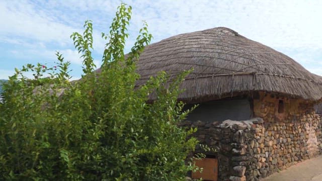 Traditional Stone Fences and Thatched Roof Houses