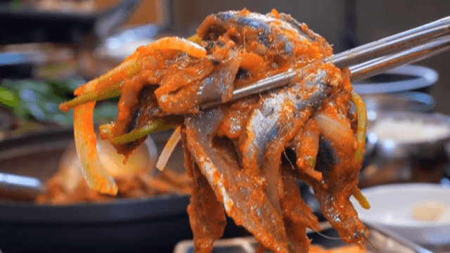 Appetizing anchovy wrap eaten at a restaurant