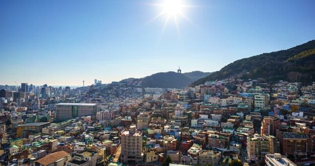 City filled with buildings from day to night